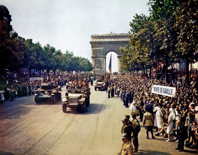Crowds of French patriots line the Champs Elysees to view Free French tanks and half tracks of General Leclerc's 2nd Armored Division passes through the Arc du Triomphe, after Paris was liberated on August 26, 1944.